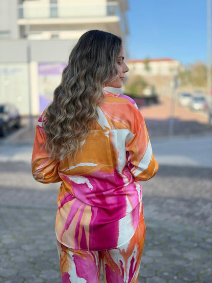 Blusa fluída estampada de ombro caído