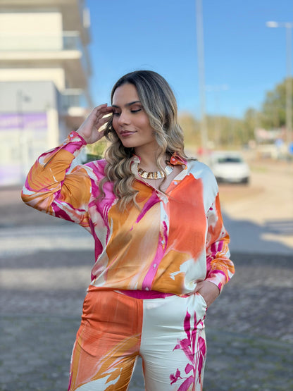 Blusa fluída estampada de ombro caído