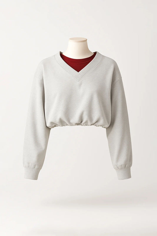 Sweatshirt cropped em cinzento com decote em V